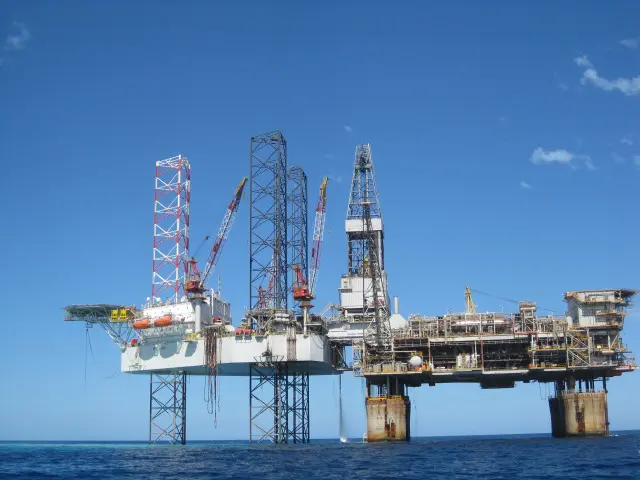 Offshore well drilling rig at sea