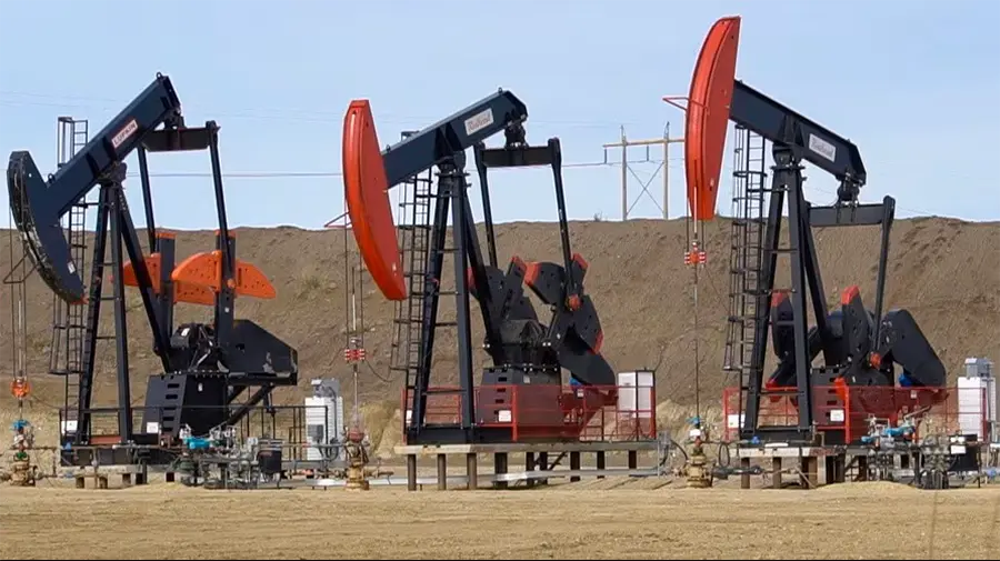 oilfield three pumpjacks at an onshore oil and gas site
